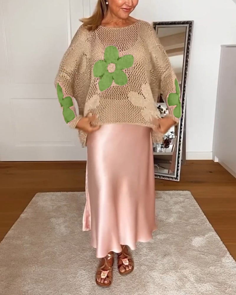 Hulmønstret sweater med blomstermotiver