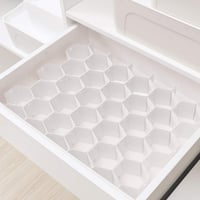 Wabenförmige Schubladenteiler-Organisation
