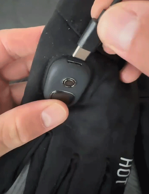 Animated demonstration of connecting the charging cable and wearing the heated gloves