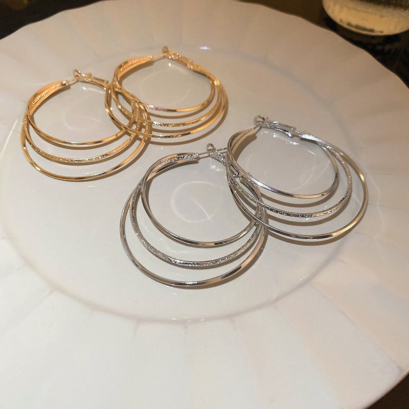 Boucles d'oreilles créoles multicouches