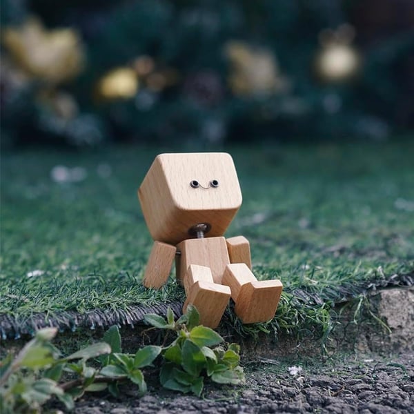 Wackelnder Holzfigur-Mann