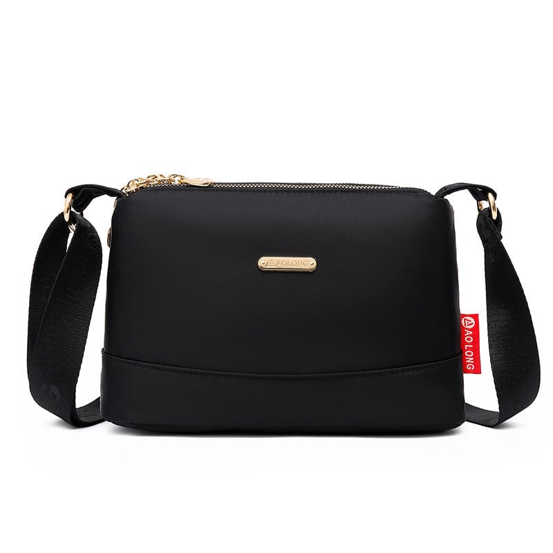 Borsa a tracolla in tela impermeabile