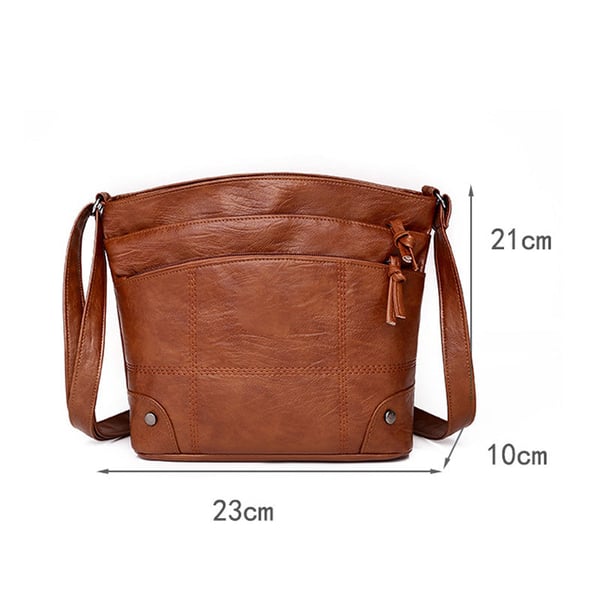 Skuldertaske i blødt læder med flere lommer og stor kapacitet