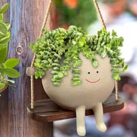 smiley schommel bloempot