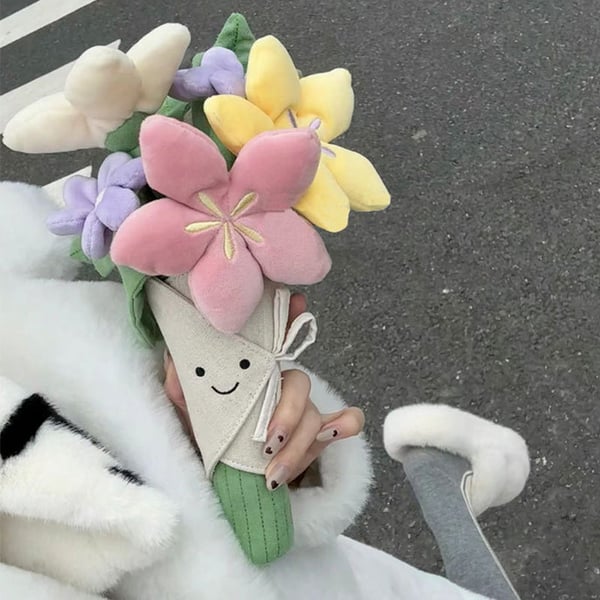 Sødt plysdyr med blomsterbuket