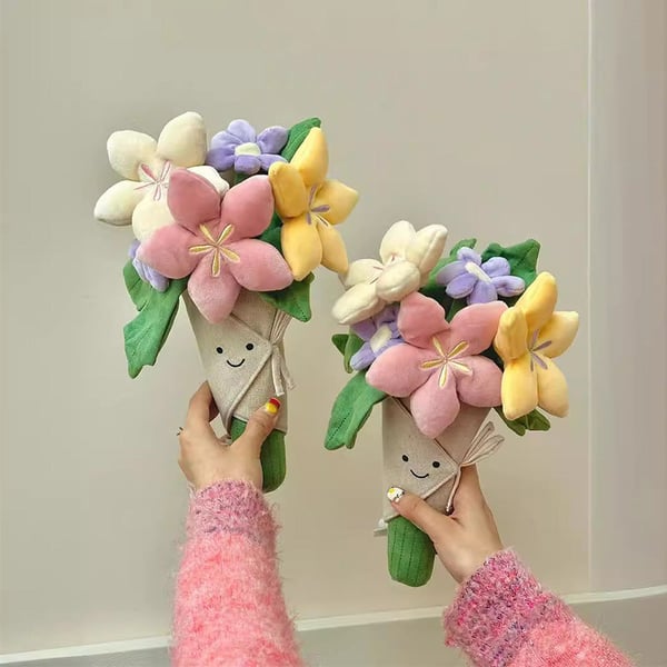 Sødt plysdyr med blomsterbuket