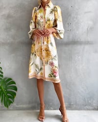 Bedrucktes Kleid mit Laternenärmeln und Reverskragen