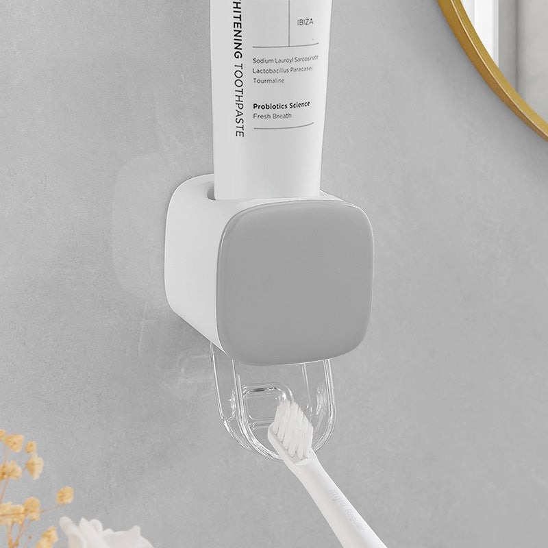 Wall-mounted toothpaste squeezer