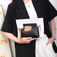Handliche Leder-Clutch, große Geldbörse mit Reißverschluss am Handgelenk