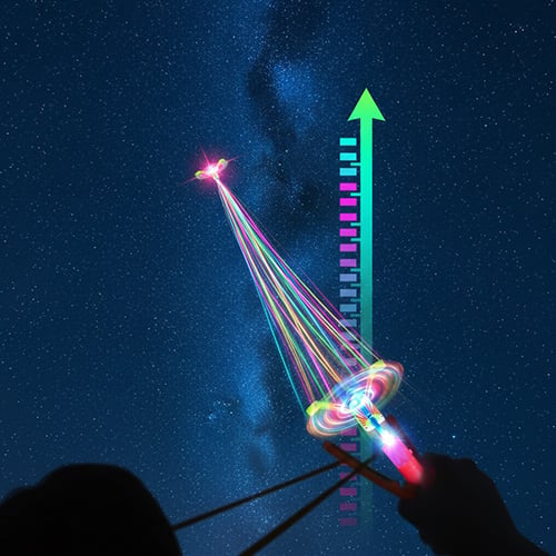 Kids playing with illuminated flying arrow