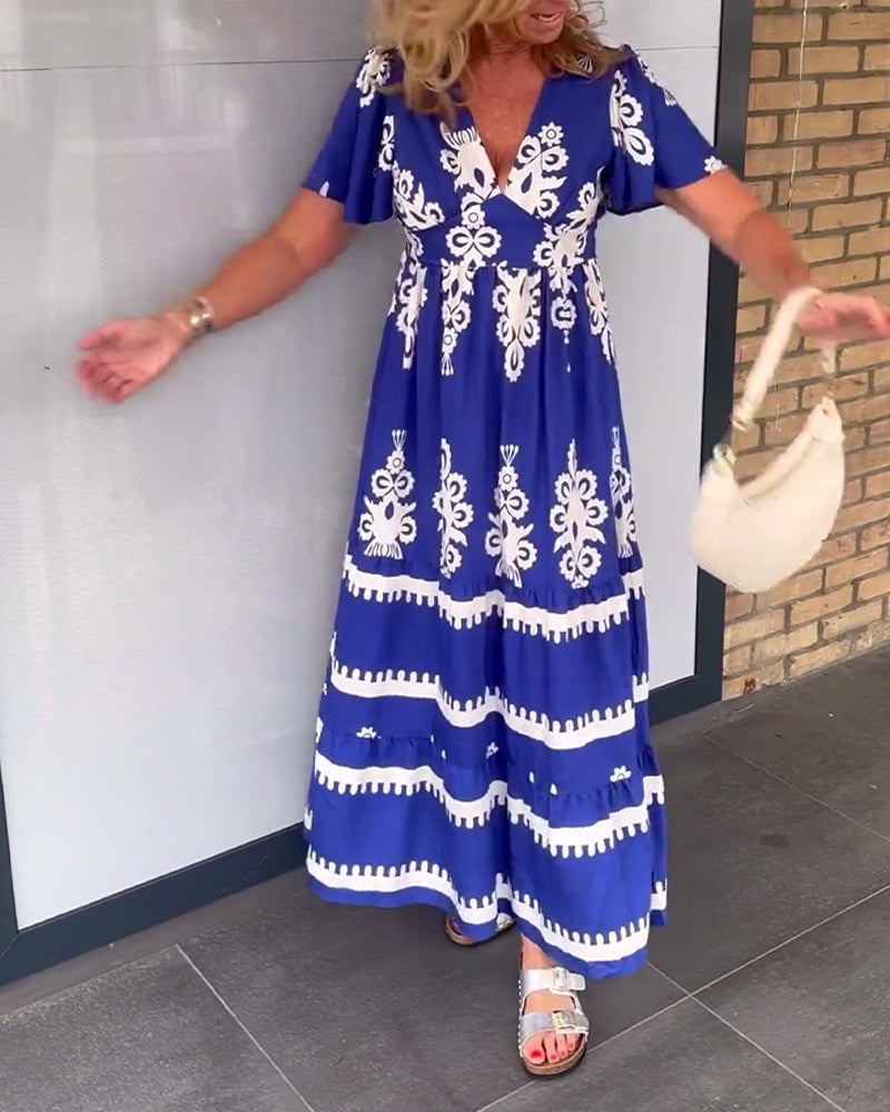 Elegant lang blå kjole med vintage print