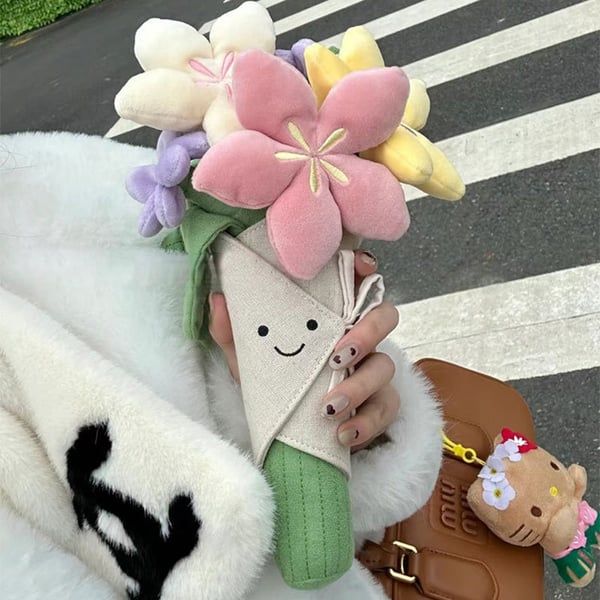 Sødt plysdyr med blomsterbuket