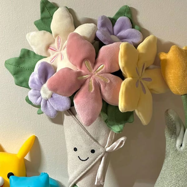 Sødt plysdyr med blomsterbuket