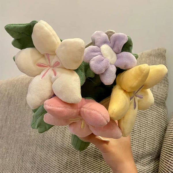 Sødt plysdyr med blomsterbuket