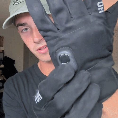 Animated close-up of the wrist button and digital display on a heated glove