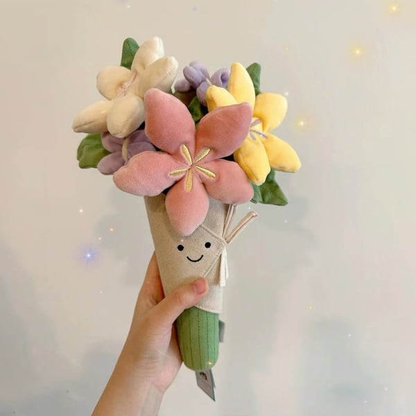 Sødt plysdyr med blomsterbuket