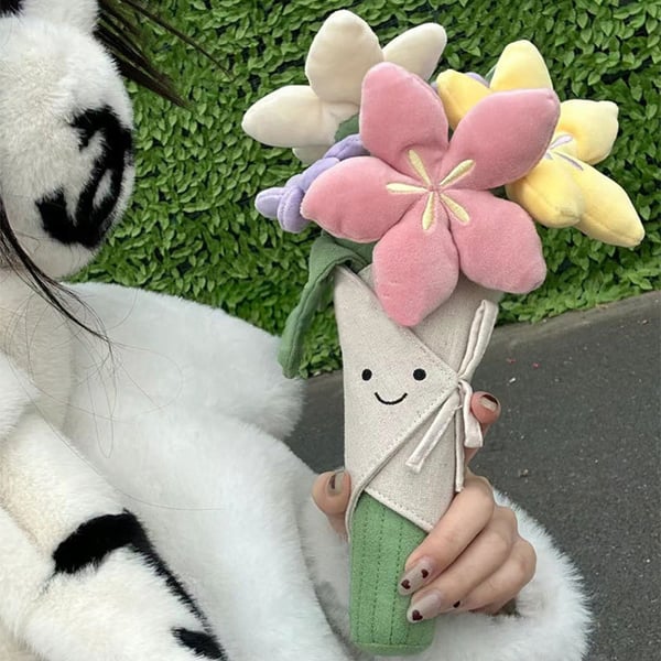 Sødt plysdyr med blomsterbuket