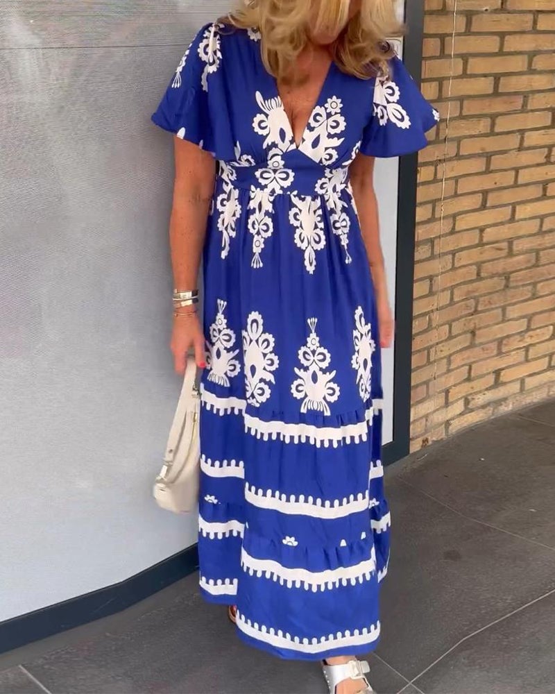 Elegant lang blå kjole med vintage print