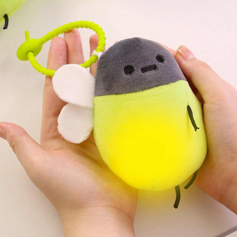 Interaktiv glödmask-plush nyckelhänge