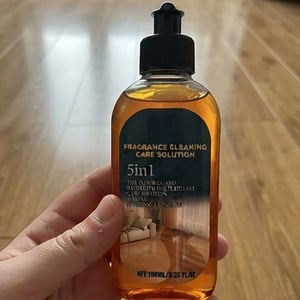 Customer holding floor cleaning solution