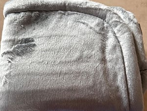 Heating pad on someone's shoulder