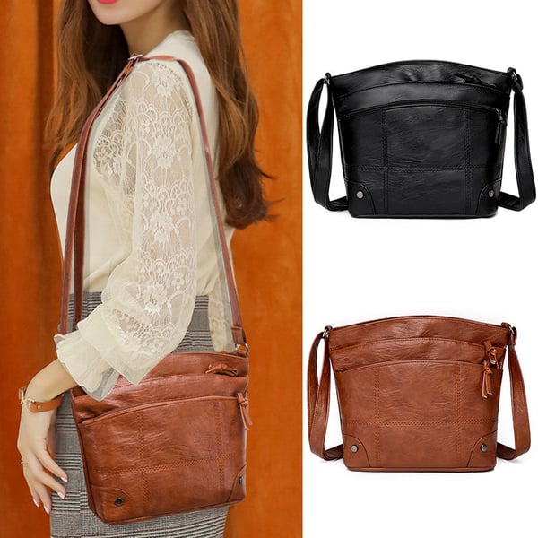 Skuldertaske i blødt læder med flere lommer og stor kapacitet