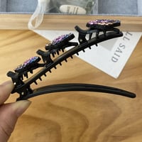 Haarclip met drie bloemen aan de zijkant