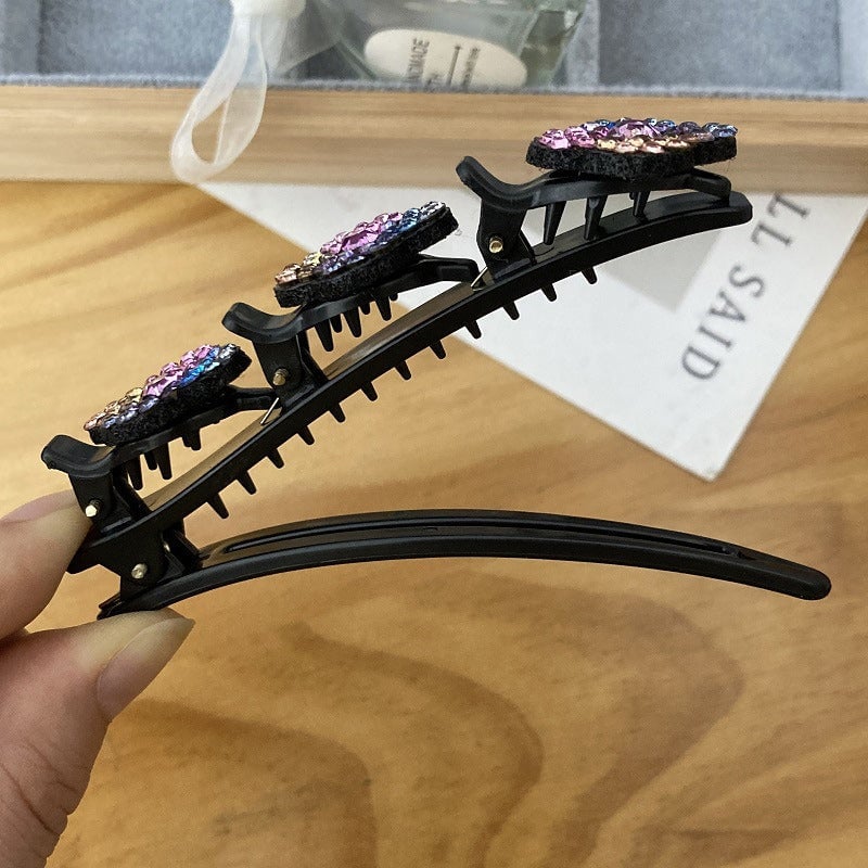Haarclip met drie bloemen aan de zijkant