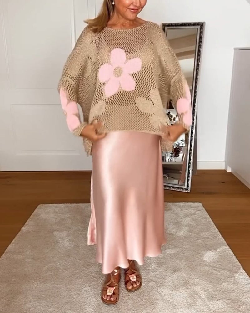 Hulmønstret sweater med blomstermotiver