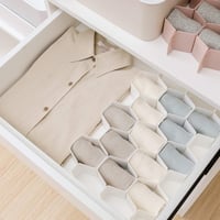 Wabenförmige Schubladenteiler-Organisation