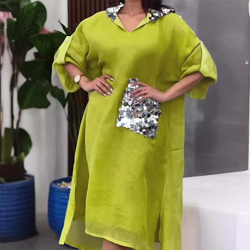 Maxi abito con cappuccio in paillettes a squame di pesce