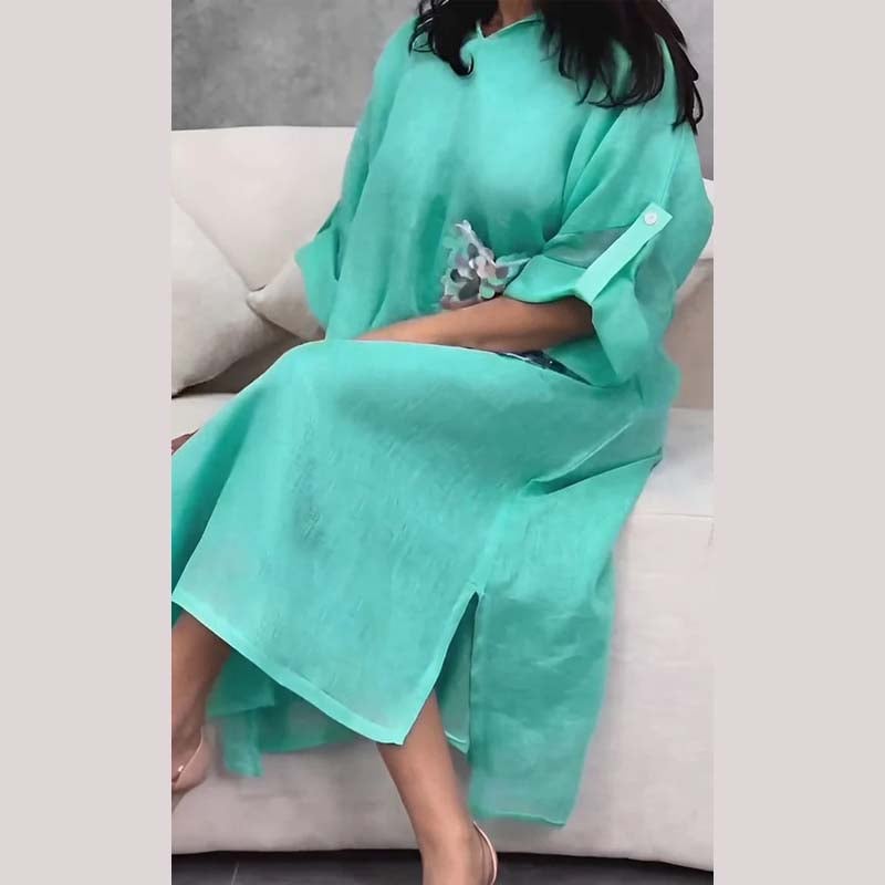 Maxi abito con cappuccio in paillettes a squame di pesce