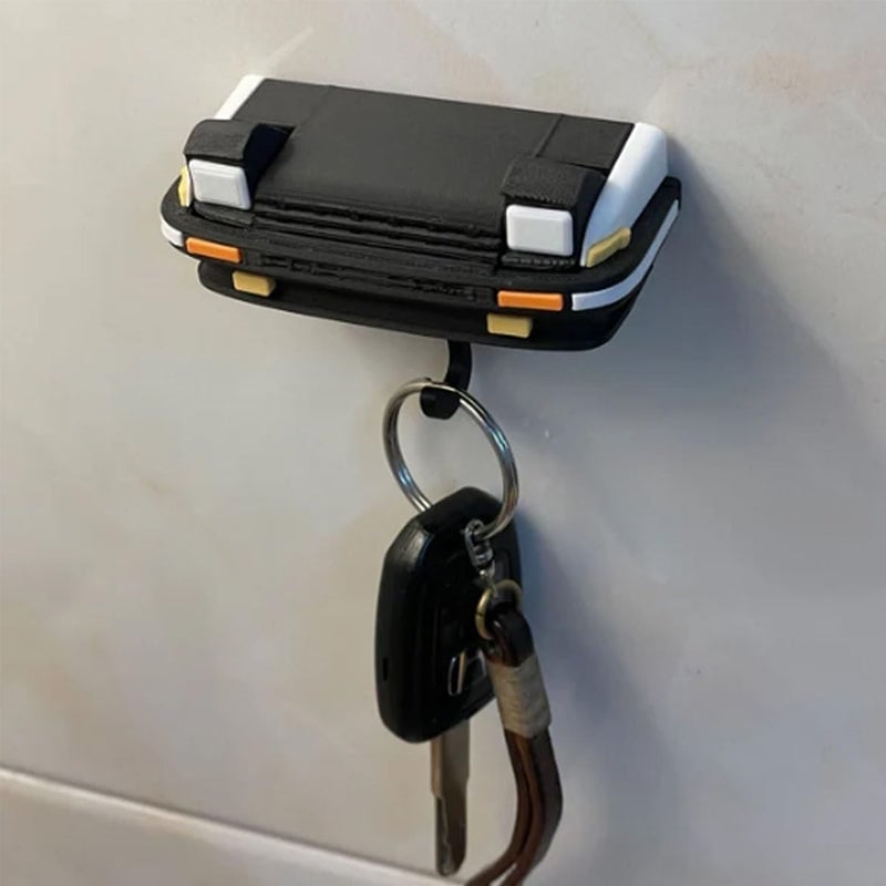Retro autosleutelhanger met open koplampen