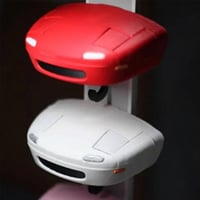 Retro autosleutelhanger met open koplampen