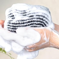 Eksfolierende antibakterielt badehåndklæde