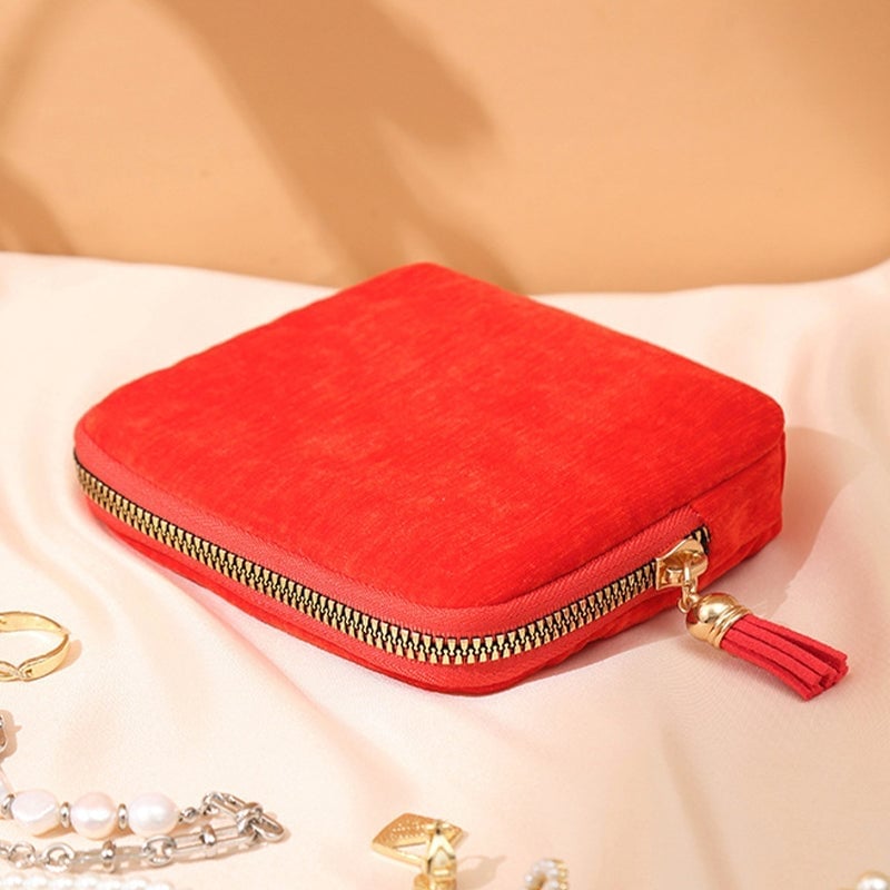Mini Schmucktasche mit Quasten-Reißverschluss
